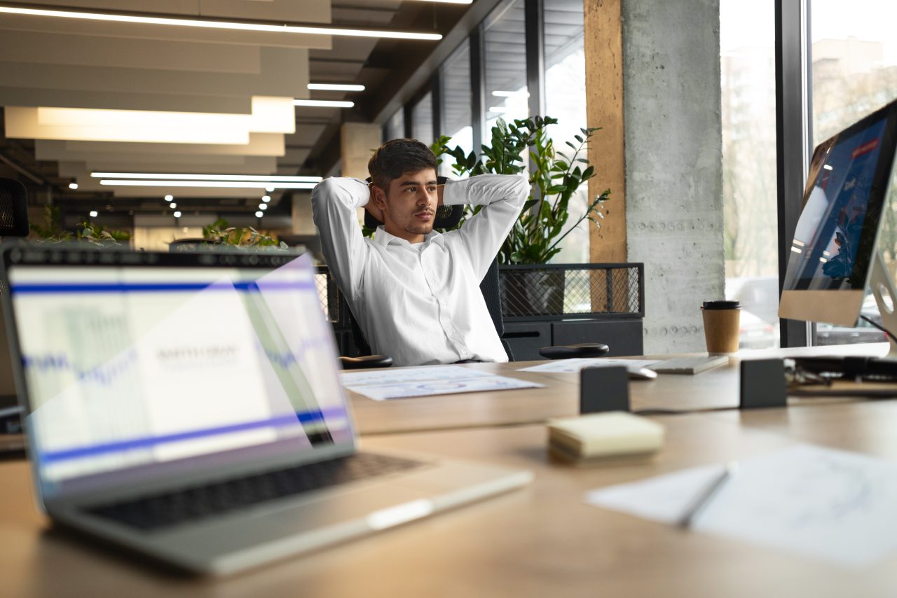person office analyzing checking finance graphs